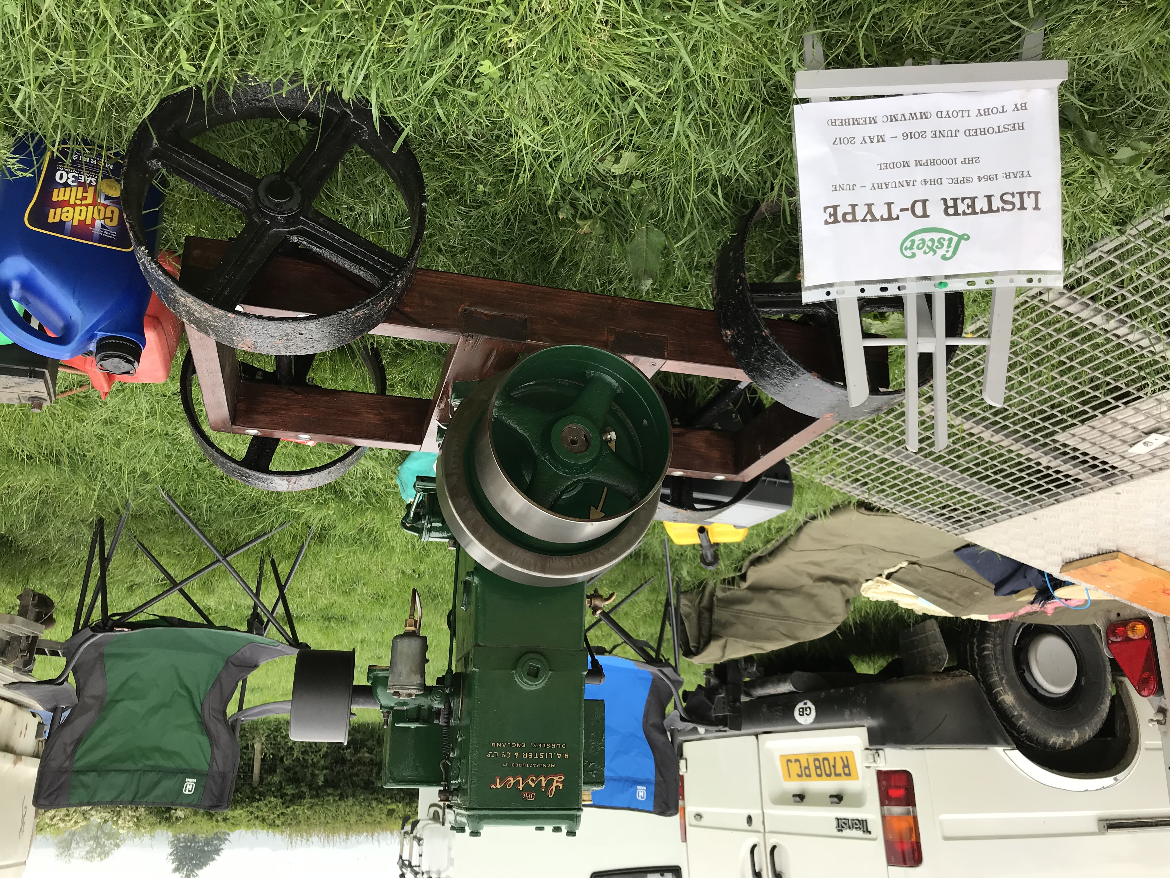 Lister D Stationary Engine on Wooden frame with Large black metal wheels.
