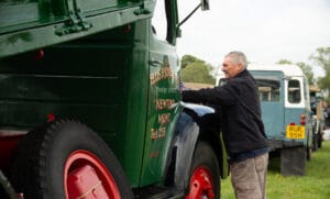 Exhibitor tending to their vintage commercial vehicle exhibit at the 2023 Vintage Rally